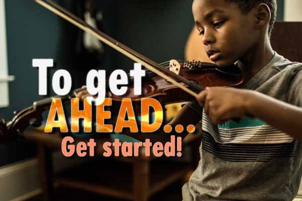 A boy playing a violin